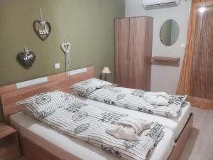 two beds in a bedroom with towels on them at Central Apartment in Thessaloniki