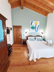 Postel nebo postele na pokoji v ubytování Agriturismo Le Cipressine