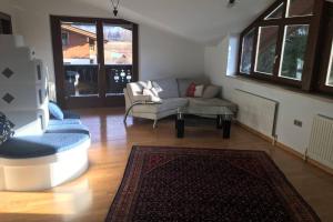Posezení v ubytování Ferienwohnung Appartement Am Schilf XL