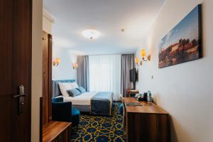 Postel nebo postele na pokoji v ubytování Hotel Jan