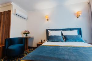 Postel nebo postele na pokoji v ubytování Hotel Jan