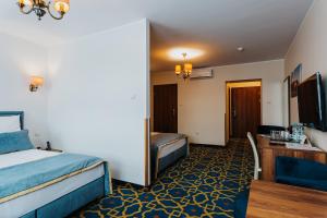 Postel nebo postele na pokoji v ubytování Hotel Jan