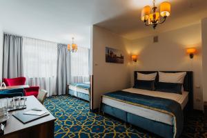 Postel nebo postele na pokoji v ubytování Hotel Jan