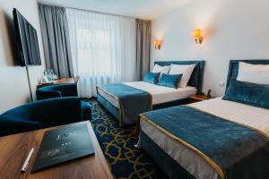 Postel nebo postele na pokoji v ubytování Hotel Jan
