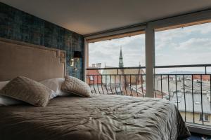 Postel nebo postele na pokoji v ubytování Hotel Jan