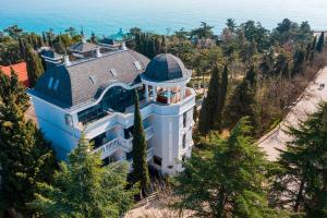 an aerial view of a house with a turret at Hotel Usadba Primorsky Park in Alushta