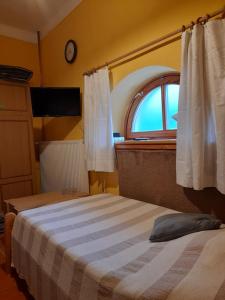 Postel nebo postele na pokoji v ubytování Agave Apartman