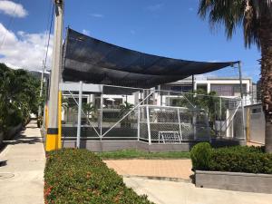 a building with a net on the side of it at Ciudadela Santa Fe in Santa Fe de Antioquia