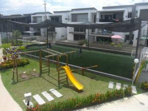 a playground with a slide in a yard at Ciudadela Santa Fe in Santa Fe de Antioquia