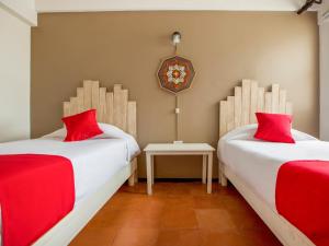 Postel nebo postele na pokoji v ubytování Hotel Allende 104