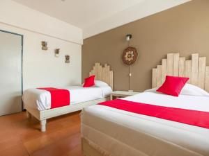 Postel nebo postele na pokoji v ubytování Hotel Allende 104