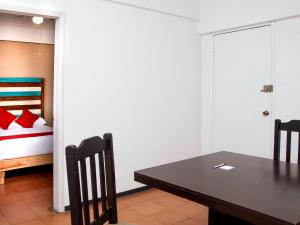 Postel nebo postele na pokoji v ubytování Hotel Allende 104