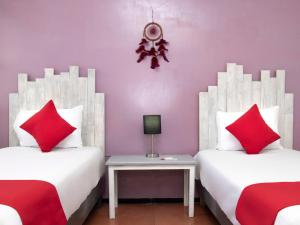 Postel nebo postele na pokoji v ubytování Hotel Allende 104