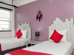 Postel nebo postele na pokoji v ubytování Hotel Allende 104