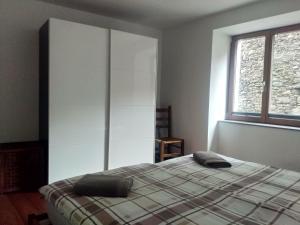Uma cama ou camas num quarto em Appartement "Luigi Loft"