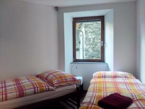 Uma cama ou camas num quarto em Appartement "Luigi Loft"