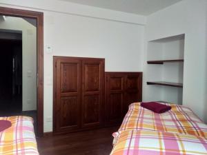 Uma cama ou camas num quarto em Appartement "Luigi Loft"