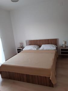 מיטה או מיטות בחדר ב-Apartment Luka