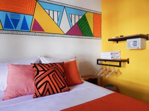 Postel nebo postele na pokoji v ubytování ETHNIC Thematic Hotel