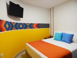 Postel nebo postele na pokoji v ubytování ETHNIC Thematic Hotel
