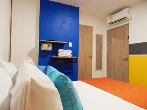 Postel nebo postele na pokoji v ubytování ETHNIC Thematic Hotel