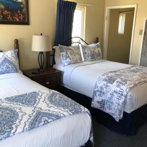 Кровать или кровати в номере Rest Haven Motel