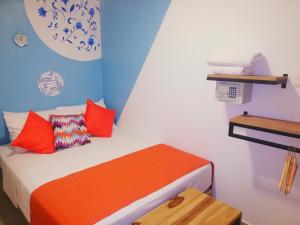 Postel nebo postele na pokoji v ubytování ETHNIC Thematic Hotel