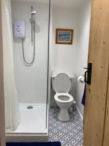 a bathroom with a shower with a toilet and a shower at 5 Union Road in Lincoln