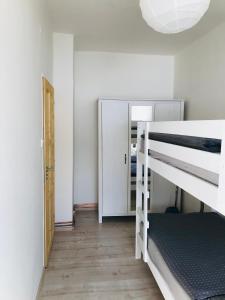 Postel nebo postele na pokoji v ubytování Apartmán Orlické Záhoří