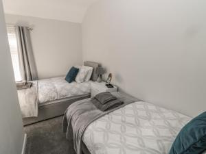 Postel nebo postele na pokoji v ubytování Pebble Cove