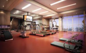 a gym with treadmills and exercise equipment in a room at Flat Completo in Cotia