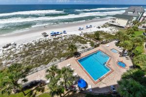 an aerial view of a beach with a swimming pool at Commodore Resort #704 by Book That Condo in Panama City Beach