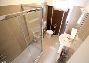 a bathroom with a glass shower and a toilet at Apartment in Vrbnik - Insel Krk 36872 in Vrbnik +13 photos