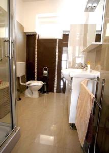 a bathroom with a sink and a toilet at Apartment in Vrbnik - Insel Krk 36872 in Vrbnik