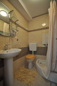 a bathroom with a sink and a toilet and a shower at Apartment in Vrbnik/Insel Krk 36796 in Vrbnik