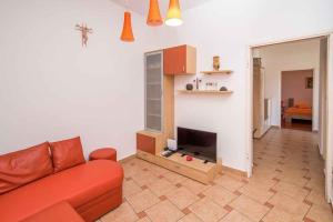 a living room with a couch and a flat screen tv at Apartment in Vrbnik/Insel Krk 36842 in Vrbnik