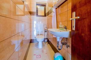 a bathroom with a sink and a toilet at Apartment in Crikvenica 14098 in Dramalj