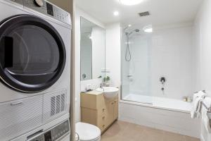 a bathroom with a sink, toilet and bathtub at Quest Echuca in Echuca