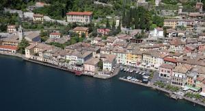 an aerial view of a town next to the water at Hotel Garnì Riviera in Gargnano