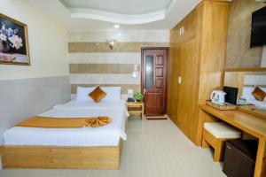 Postel nebo postele na pokoji v ubytování Oliver Hotel