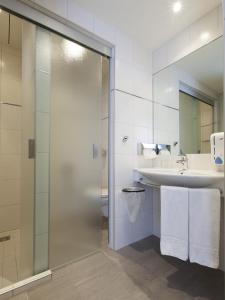 a bathroom with a shower and a sink at Landzeit Tauernalm in Flachau