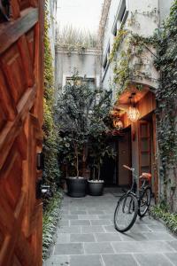 a bicycle is parked in front of a building at CASA EMILIA B&B Boutique in Mexico City
