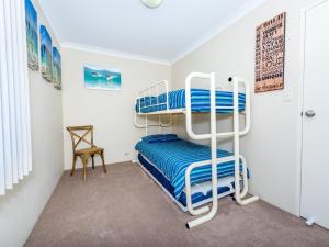 a bedroom with two bunk beds in a room at Collendina 15 19 Kurrawa Close water views and wifi in Nelson Bay