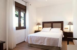 Postel nebo postele na pokoji v ubytování Hotel Antonio