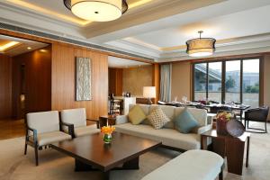 a living room with a couch and a table at InterContinental Kunming, an IHG Hotel in Kunming