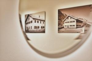a view of two pictures on a wall at Arlberg Öko Ferienwohnungen in Innerbraz