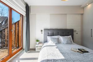 Posteľ alebo postele v izbe v ubytovaní Apartament PAULA Zakopane