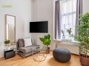 TV a/nebo společenská místnost v ubytování Apartment Berlin Paul-Robeson-Straße