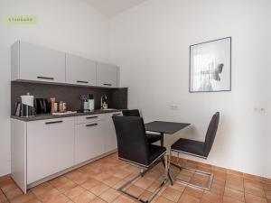 Kuchyň nebo kuchyňský kout v ubytování Apartment Berlin Paul-Robeson-Straße + 4 fotografie