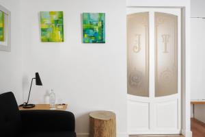 a living room with a white cabinet and a table at Mon hotel in Ciutadella